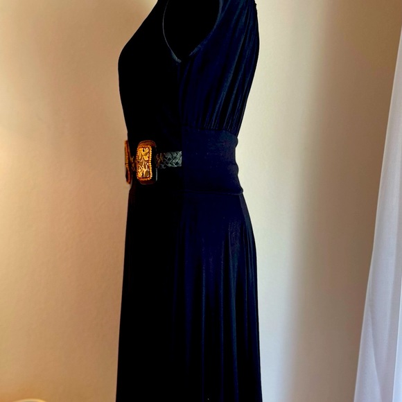 Simple black dress with built-in accents. - Picture 2 of 3